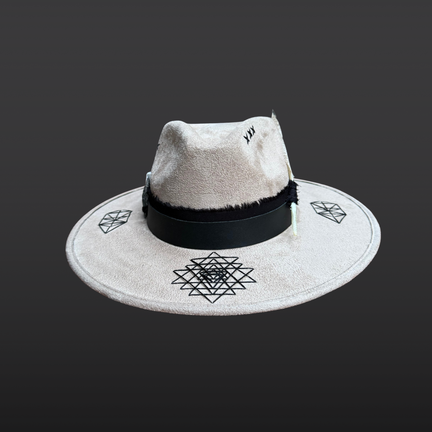 Front view of Rooted Light fedora showing hand embroidered Sri Yantra symbol, black leather band, organic cotton band and crystal accents.