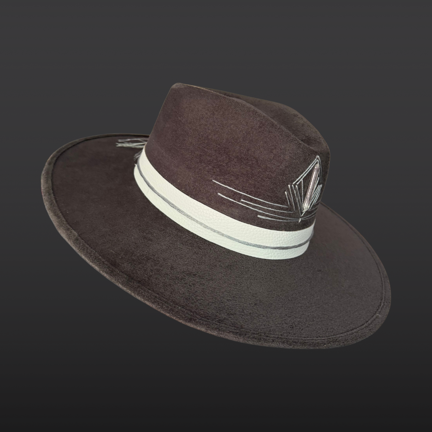 Gray wide brim fedora hat with a white leather band, silver accents, and a Lemurian quartz centerpiece.