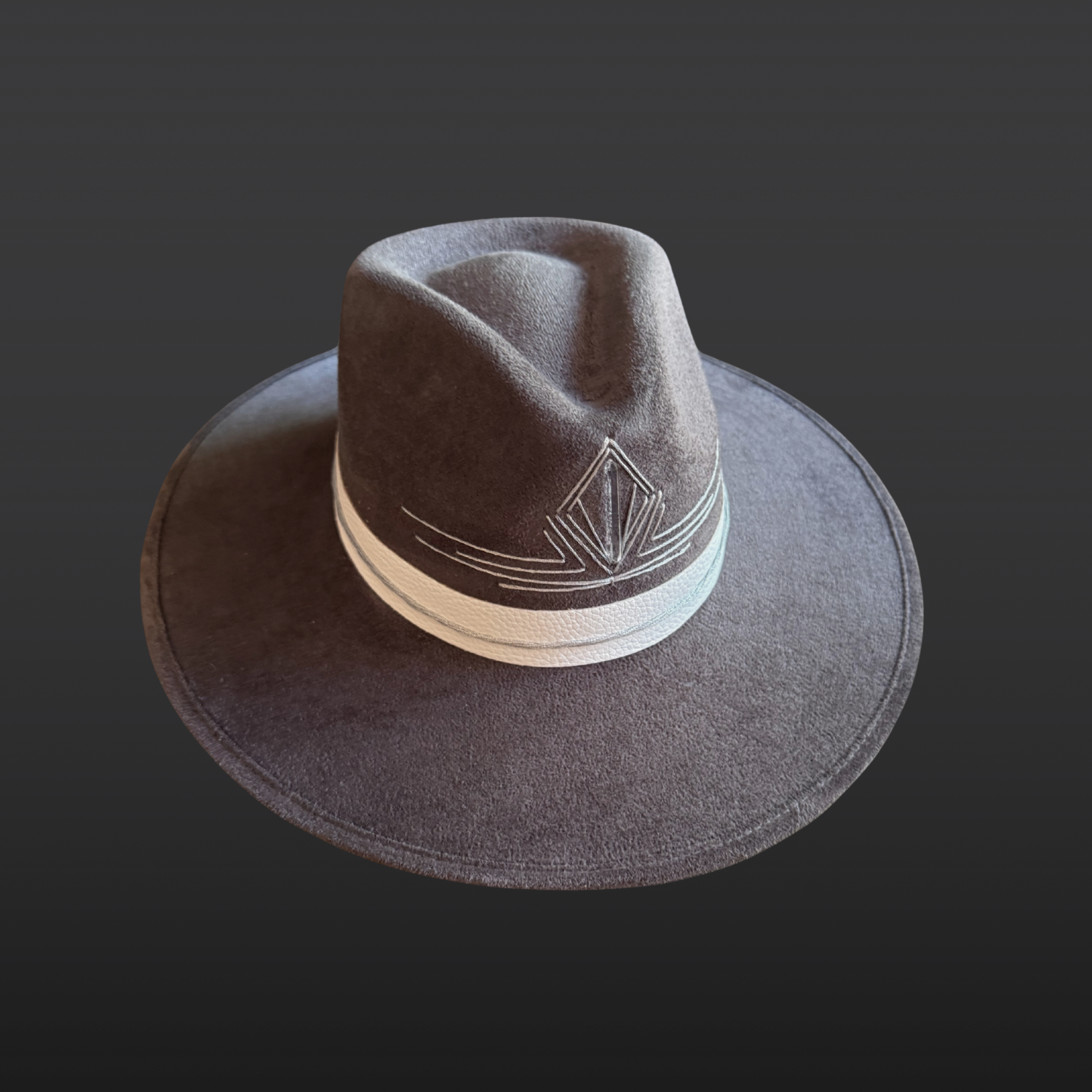 Front Left side view of a gray statement fedora featuring a hand-embroidered silver triangle and Lemurian quartz crystal.